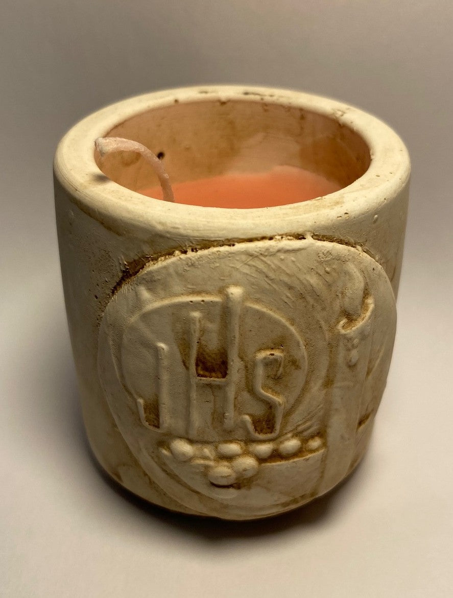 Small earthenware candleholder with IHS motif