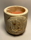 Small earthenware candleholder with IHS motif