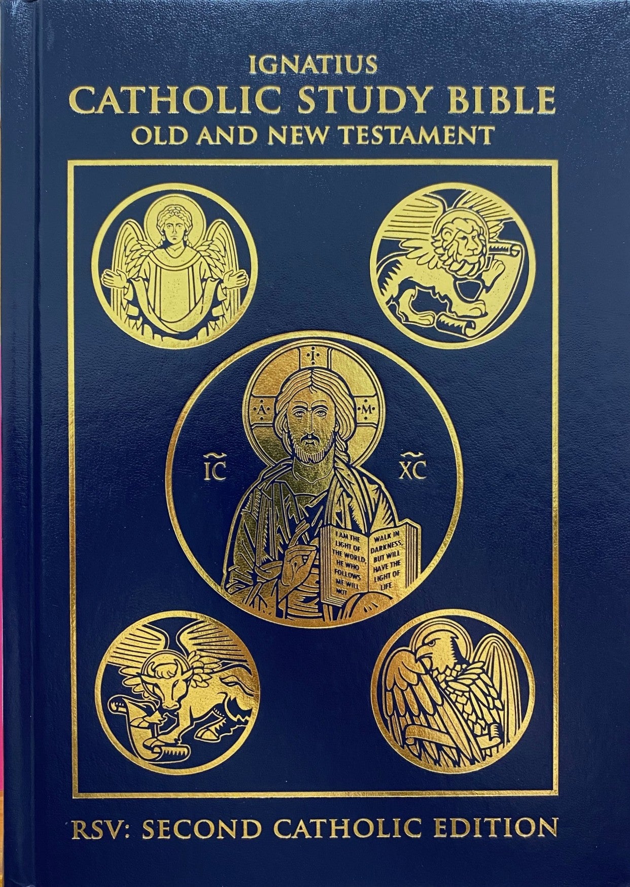 Blue and gold cover of the Ignatius Catholic Study Bible with religious symbols.